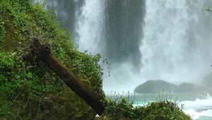   Stock Footage Waterfall Behind The Rocks Live Wallpaper