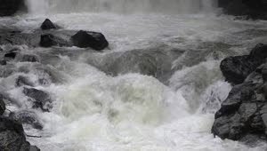   Stock Footage Water Flowing Down The River Between Black Rocks Live Wallpaper