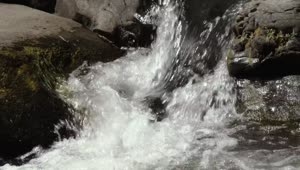   Stock Footage Water Crashes Among Rocks Live Wallpaper