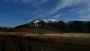   Stock Footage View Of Drone Flying Over Trees Towards Mountain Live Wallpaper