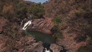   Stock Footage View Of A Waterfall Over Red Rocks Live Wallpaper