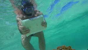 Download   Stock Footage Using A Tablet Underwater Live Wallpaper