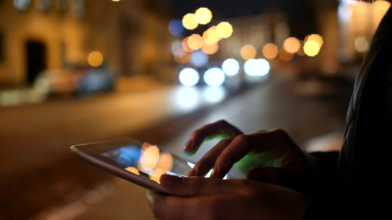 Download   Stock Footage Using A Tablet On The Street By Night Live Wallpaper