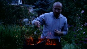   Stock Footage Using A Fire Poker Outside Live Wallpaper