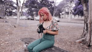   Stock Footage Urban Trendy Woman Holding An Old Photo Camera Live Wallpaper
