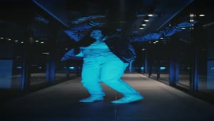   Stock Footage Urban Trendy Woman Dancing In A Dark Corridor Live Wallpaper