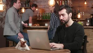   Stock Footage Urban Man Typing On Laptop Is Served Coffee In Hip Live Wallpaper