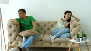   Stock Footage Upset Couple Sitting In An Armchair Live Wallpaper