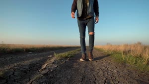   Stock Footage Unknown Man Walking In A Dirt Road Live Wallpaper
