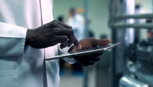   Stock Footage Typing On The Tablet In The Laboratory Live Wallpaper