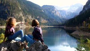   Stock Footage Two Young Women Chilling And Watching The Lake Live Wallpaper