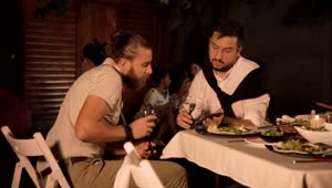  Stock Footage Two Young Men Talking At A Dinner Party Live Wallpaper