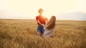   Stock Footage Two Young Girls Spinning In A Wheatfield Live Wallpaper