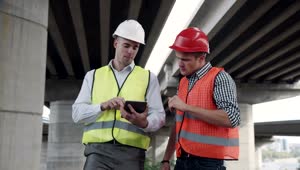   Stock Footage Two Workers Discussing Project Outdoors Live Wallpaper