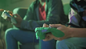   Stock Footage Two Players Pressing The Buttons Of A Video Game Control Live Wallpaper