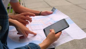   Stock Footage Two People Sitting On A Bench Looking At Maps Of Live Wallpaper