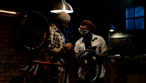   Stock Footage Two Mechanics Talking In A Bike Workshop Live Wallpaper