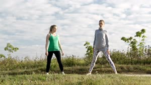   Stock Footage Two Girls Doing Yoga In A Field Live Wallpaper