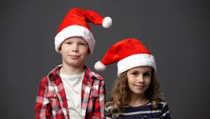   Stock Footage Two Children In Christmas Hats Live Wallpaper