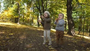  Stock Footage Two Children Enjoying Autumn Live Wallpaper