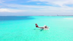   Stock Footage Turquoise Sea With A Plane Floating Live Wallpaper
