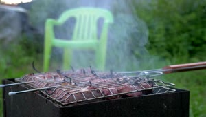   Stock Footage Turning Over Meats On The Grill Live Wallpaper