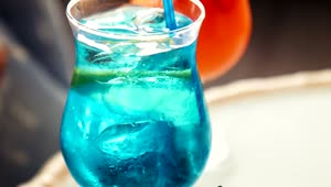   Stock Footage Tropical Blue Beverage With A Fruit Slice Live Wallpaper