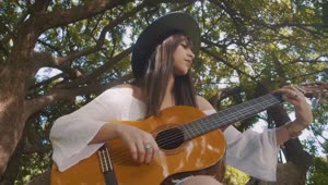 Stock Footage Woman Playing An Acoustic Guitar Outside Live Wallpaper Free