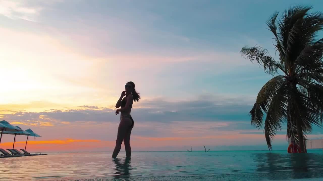 Download Stock Footage Woman Doing Yoga In A Pool At Sunset Live Wallpaper Free