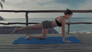 Stock Footage Woman Doing Yoga On A Deck At The Beach Live Wallpaper Free