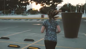 Stock Footage Woman Jogging Through Parking Lot Live Wallpaper Free