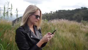 Stock Footage Woman Texting In Nature Live Wallpaper Free