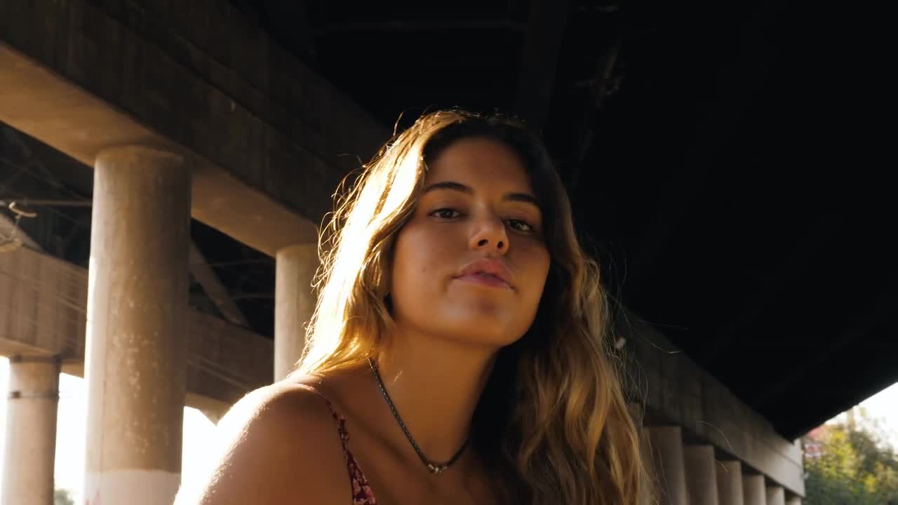 Download Stock Footage Woman Under A Bridge Live Wallpaper Free