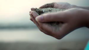 Stock Footage Woman Holding Wet Sand Live Wallpaper Free