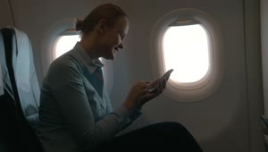 Stock Footage Woman Using Her Phone During A Flight Live Wallpaper Free