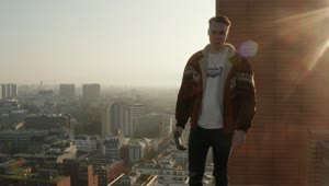 Stock Footage Young Man Standing On The Rooftop Of A Building Live Wallpaper Free