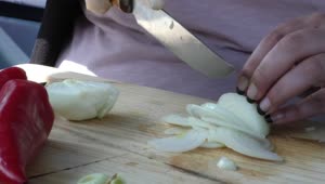 Stock Footage Woman Slicing An Onion On A Board Live Wallpaper Free