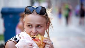 Stock Footage Woman Eating Fast Food In The Street Live Wallpaper Free