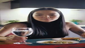 Stock Footage Woman Drinks Water From Her Glass During Her Meal Live Wallpaper Free