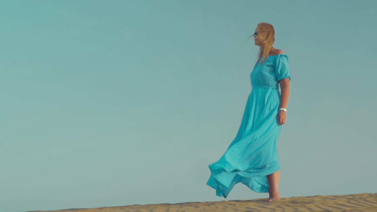 Download Stock Footage Woman Standing Still In A Blue Dress Live Wallpaper Free