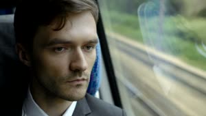 Stock Footage Worried Man By The Window Of A Train In Movement Live Wallpaper Free