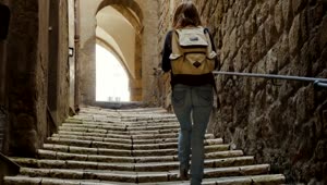 Stock Footage Woman With A Backpack Walking Up The Stairs Live Wallpaper Free