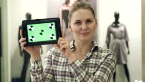 Stock Footage Women Showing A Tablet With A Green Screen Live Wallpaper Free