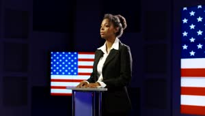 Stock Footage Woman Giving A Speech With Flag In The Background Live Wallpaper Free