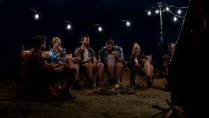 Stock Footage Young People Watching Movies At The Campfire Live Wallpaper Free