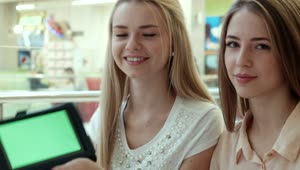 Stock Footage Young Women Showing A Tablet With A Green Screen Live Wallpaper Free