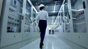Stock Footage Woman With Helmet Walking In A Factory Hallway Live Wallpaper Free