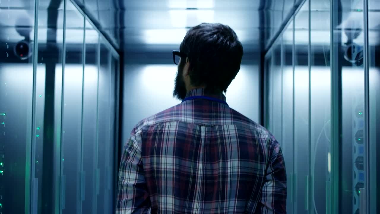 Download Stock Footage Young Man Walking In The Server Room Live Wallpaper Free
