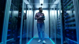 Stock Footage Young Engineer Walking Through Data Center Live Wallpaper Free
