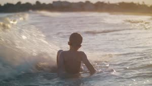 Stock Footage Young Boy Playing In The Waves Live Wallpaper Free